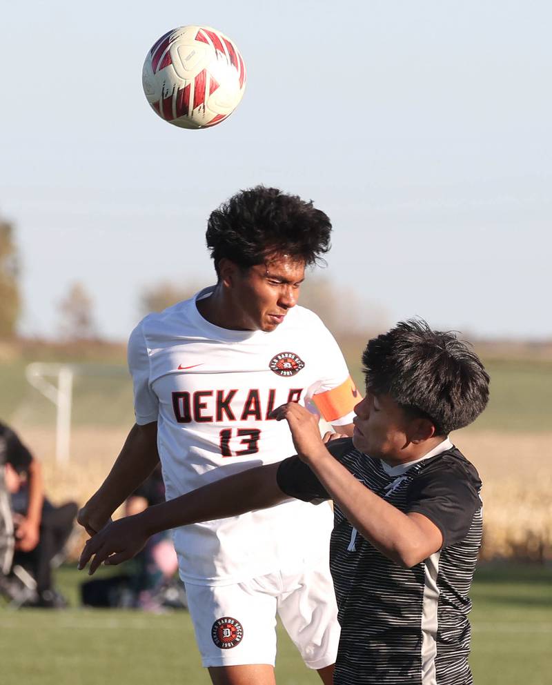 DeKalb's Henry Garcia-Alvarez heads the ball over Kaneland's Abe Paulino during their game Thursday, Oct. 17, 2024, at Kaneland High School in Maple Park.