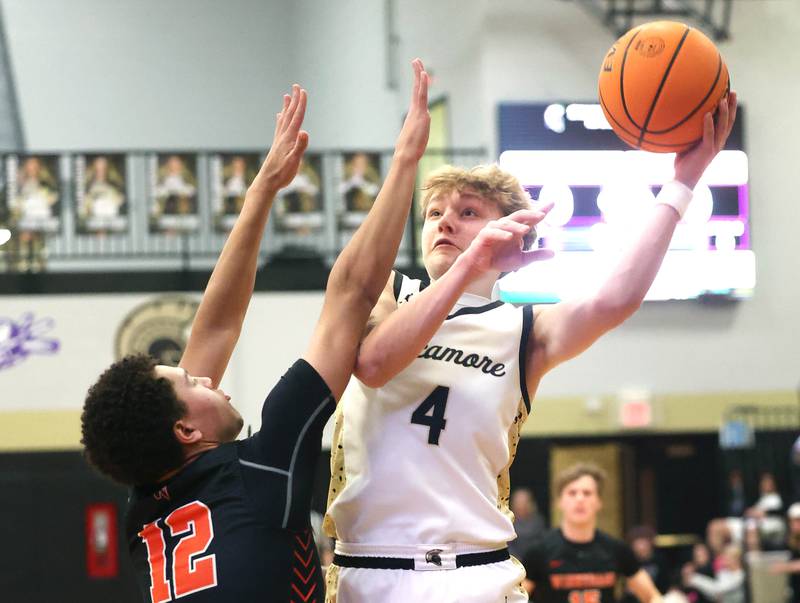 Sycamore's Isaiah Feuerbach shoots over Winnebago's Blaise Brown during their game Monday, Jan. 27, 2025, at Sycamore High School.