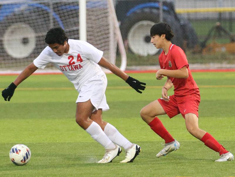 Ottawa's Luis Bedolla cuts in front of L-P's Adrian Gonzalez to advance the ball up the field on Monday, Sept. 11, 2023 at the L-P Athletic Complex in La Salle.