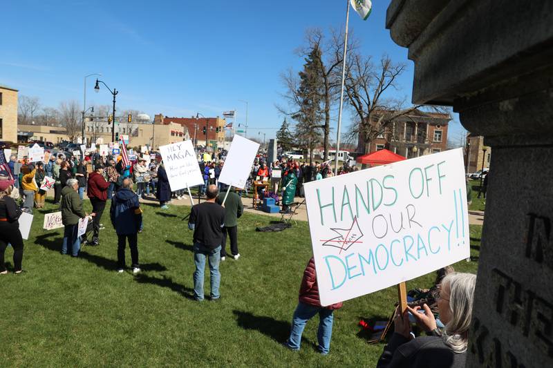 Protesters gather to listen to speakers during the No Kings rally at the Kankakee County Courthouse on March 28, 2026.