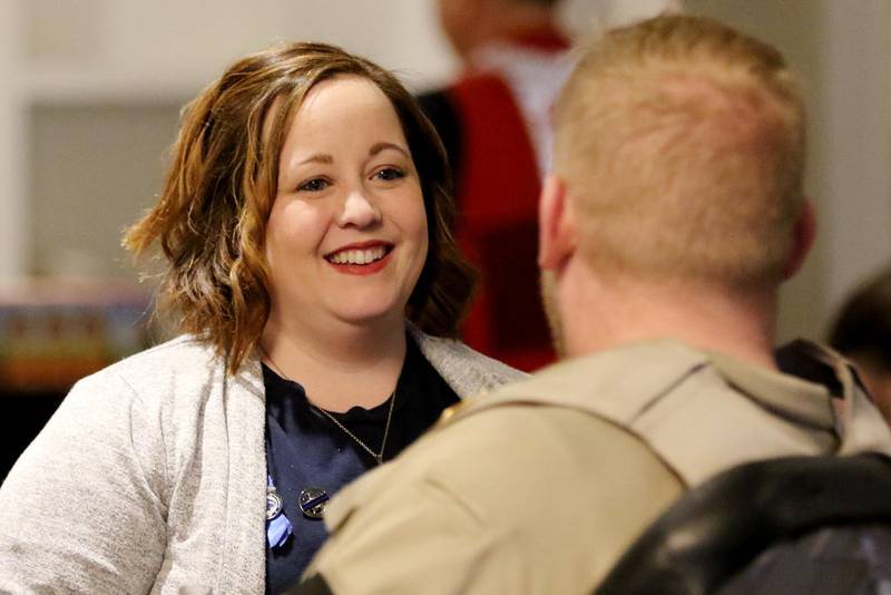 Becki Keltner, wife of fallen McHenry County sheriff's Deputy Jacob Keltner, talks with Illinois Department of Natural Resources Conservation Police Officer Tom Davis as Davis has his blood drawn during a blood drive Jan. 9, 2020, in Crystal Lake.