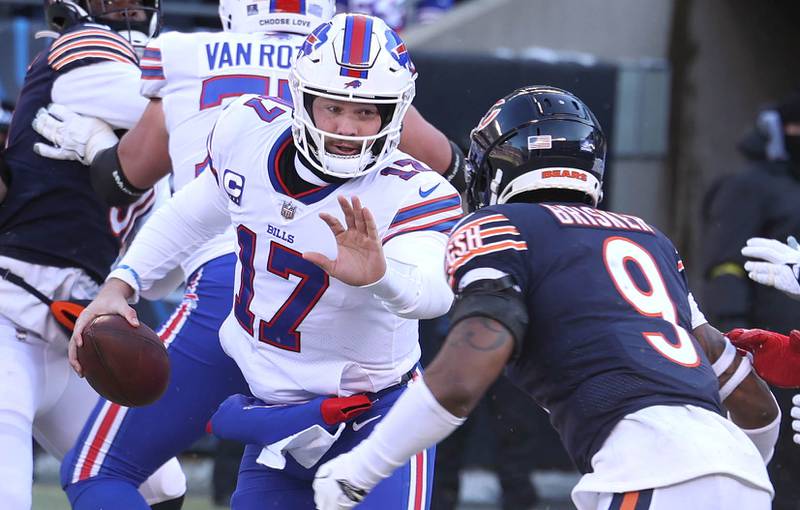 Buffalo Bills quarterback Josh Allen tries to get by Chicago Bears safety Jaquan Brisker during their game Sunday, Dec. 24, 2022, at Soldier Field in Chicago.