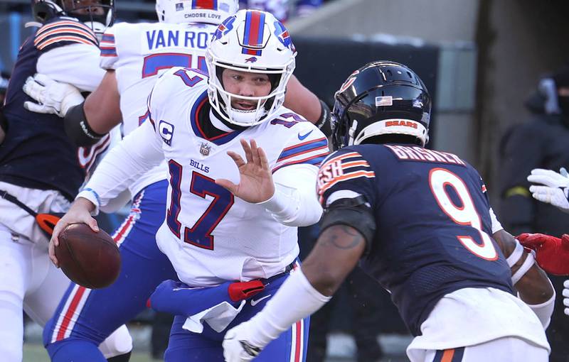 Buffalo Bills quarterback Josh Allen tries to get by Chicago Bears safety Jaquan Brisker during their game Sunday, Dec. 24, 2022, at Soldier Field in Chicago.