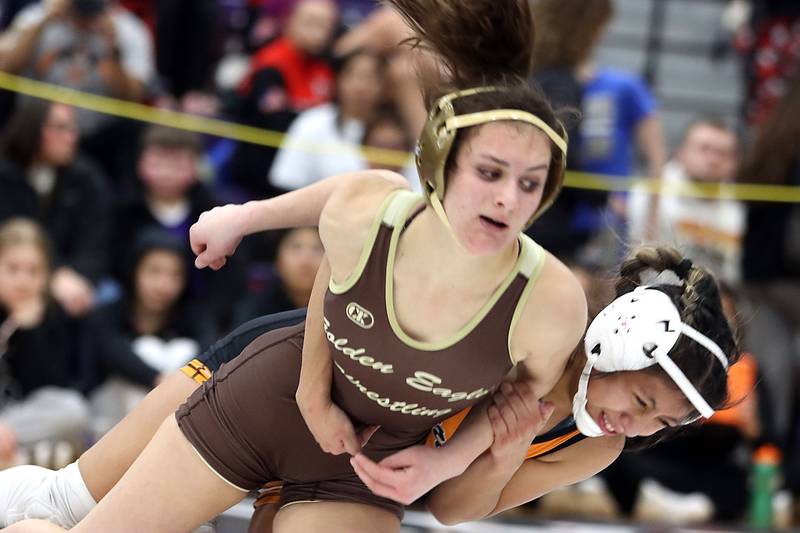 Jacobs’ Julia Felton, left, battles McHenry’s Alexa Colin-Garcia at 110 pounds in varsity girls IHSA Regional Championship wrestling action on Saturday, February 7, 2026, at Hampshire High School in Hampshire.