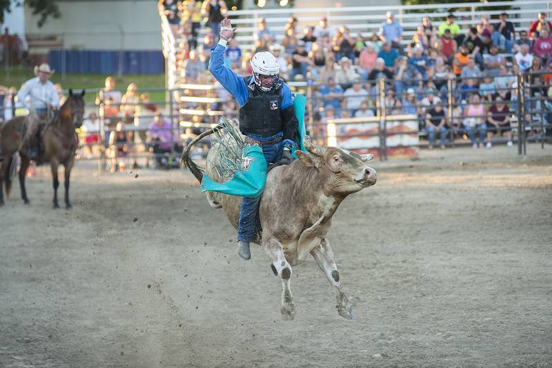 Levi Boyd hangs on August 16, 2022 during action at the Whiteside County fair. The Next Level Pro Bull Riding tour made a stop Tuesday in Morrison.