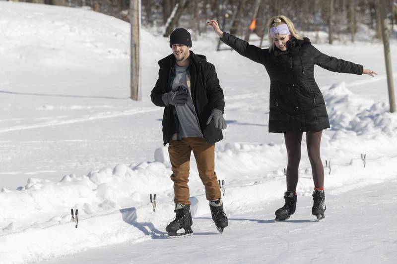 Skylar (left) and Logan Wheeler cautiously make their way around the ice rink in Dixon Saturday, Jan. 20, 2024.