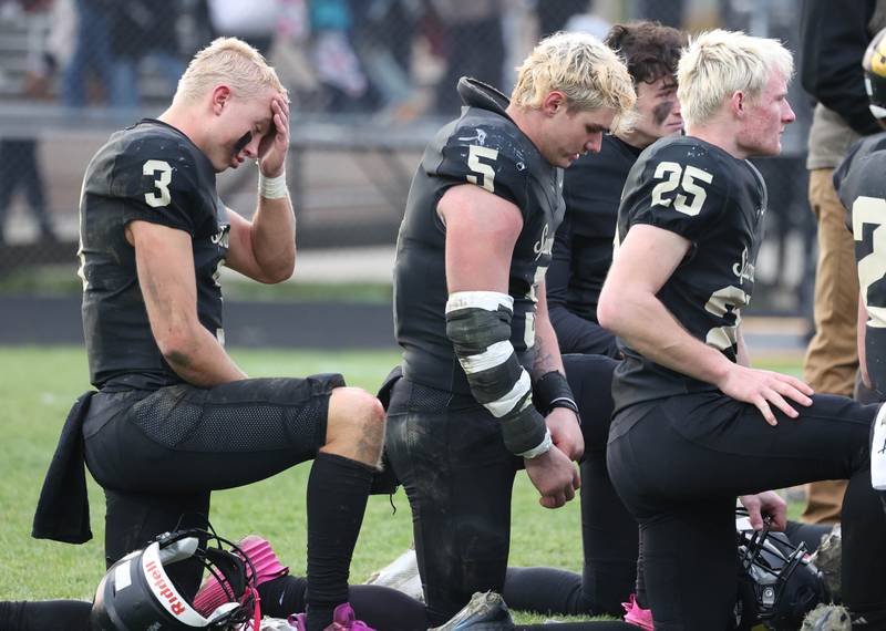 Sycamore's Carter York, (left) Kyle Prebil and Kevin Lee show their emotions Saturday, Nov. 16, 2024, after their Class 5A quarterfinal loss to St. Francis at Sycamore High School.