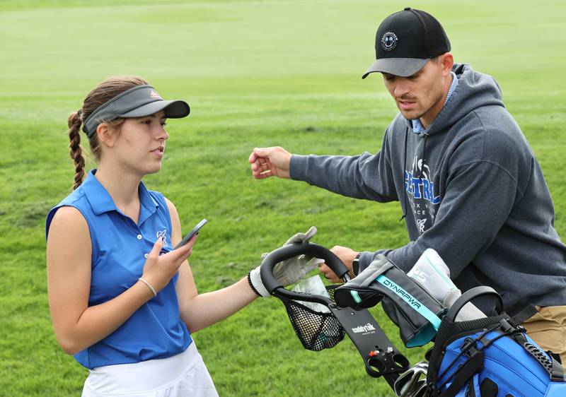 Burlington Central’s Ariana Riep talks to her coach Sean Meyer Thursday, Sept. 28, 2023, during the Class 2A girls golf regional at Sycamore Golf Club in Sycamore.