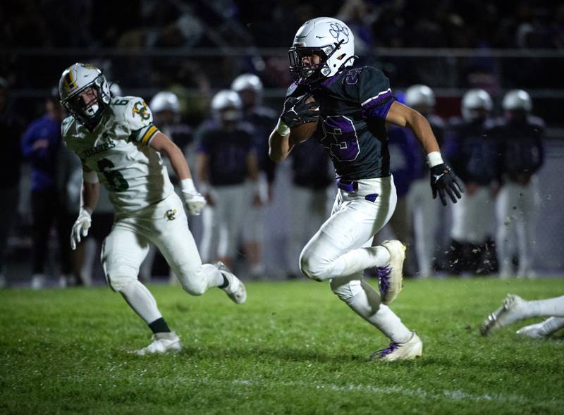 Wilmington's Hunter Kaitschuk, right, carries the ball on a play as Coal City's Cooper Morris, left, follows in a game on Friday, October 24, 2025.