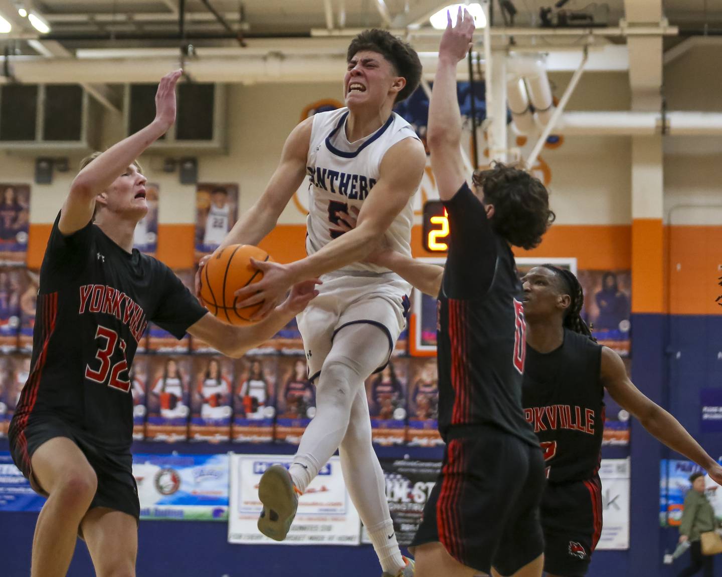 Oswego's Mariano Velasco (5) splits the defense at the basket during their basketball game between Yorkville at Oswego, Feb 7, 2026 in Oswego.