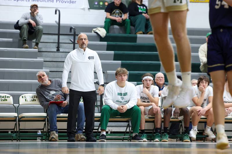 Bishop McNamara head coach Adrian Provost watches a play unfold during the Fightin' Irish's 62-25 victory over Chesterton Academy on Wednesday, Jan. 7, 2026.