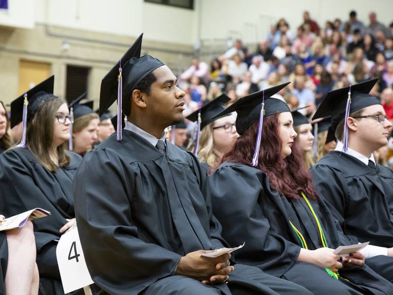 Graduates at a previous Illinois Valley Community College commencement in the gym. IVCC returns to in-person commencement at 1:30 p.m. Saturday, May 14.