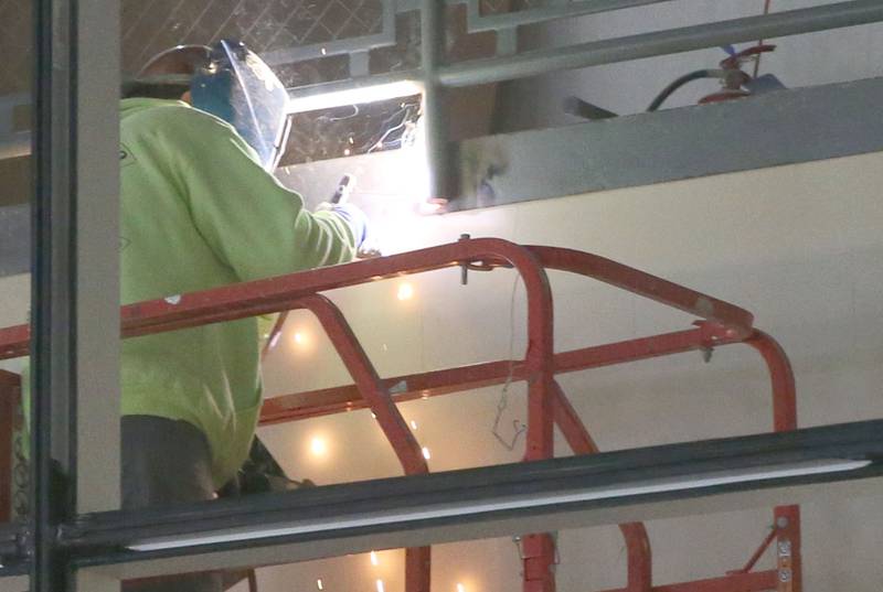 A worker welds a staircase at the new YMCA building on Wednesday Jan. 24, 2024 in Ottawa.