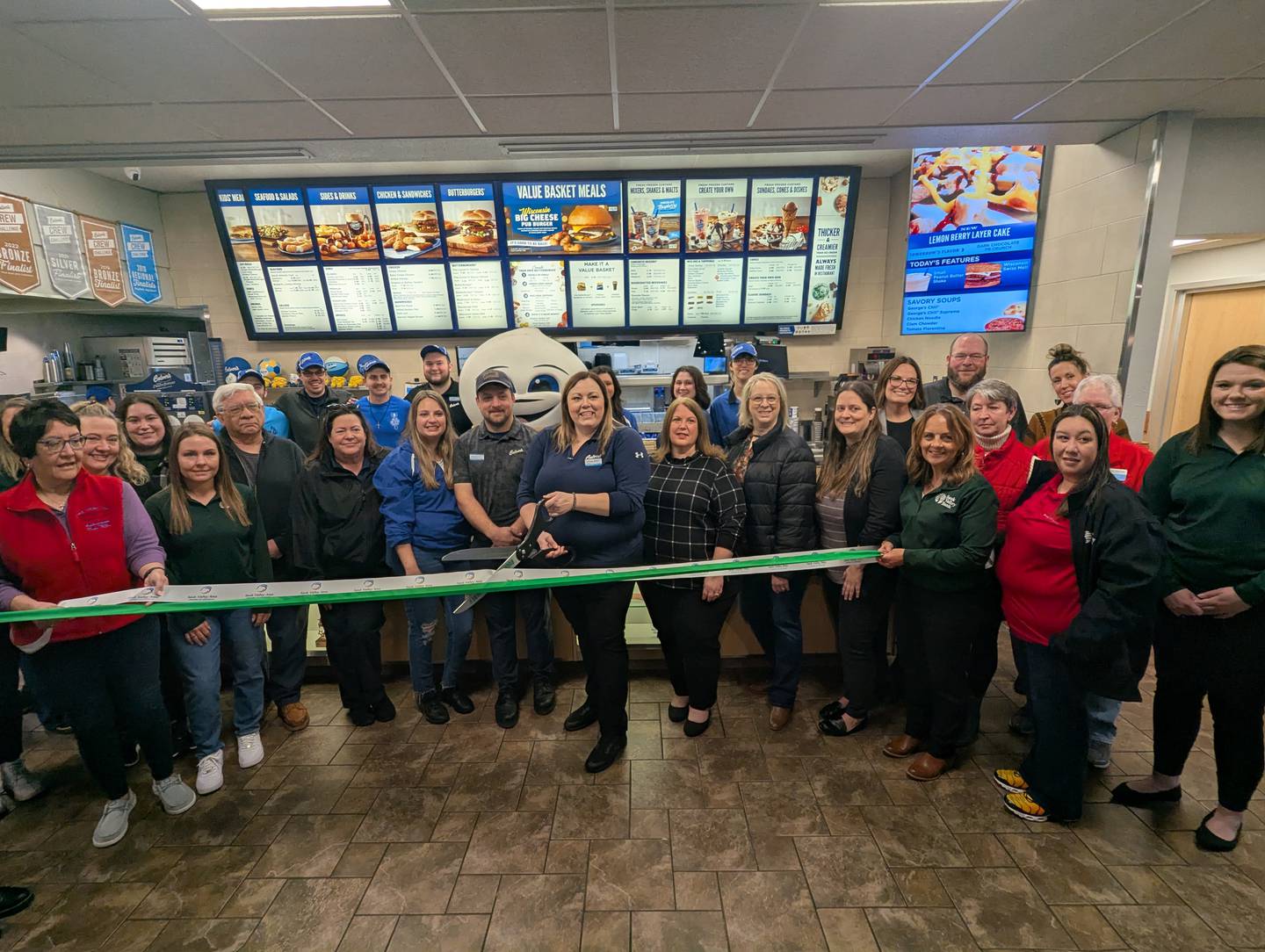 Culver’s of Rock Falls Owner/Operator Ashlee Alber prepares to cut the ribbon Friday at a ceremony celebrating a major remodeling project at the business, 1901 Harley-Davidson Drive, Rock Falls. She is pictured with General Manager John Kelly,business managers and staff, Rock Falls Mayor Rod Kleckler, the Rock Falls Chamber Board and Ambassadors and members of the Sauk Valley Area Chamber of Commerce. The restaurant is open from 10 a.m. to 10 p.m. Monday-Sunday.