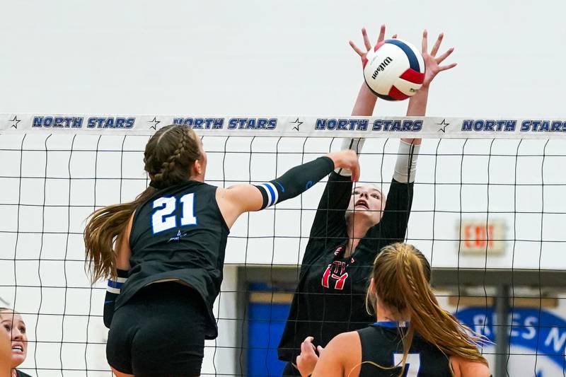 Huntley’s Lucy Watson (17) blocks a kill attempt by St. Charles North's Brynn Hopkins (21) during a non-conference match at St. Charles North High School on Wednesday, Sept. 3, 2025.