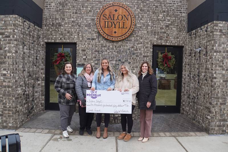 On Monday, Dec. 22, 2025, the city of Rochelle presented a facade grant program check for $1,550 to Salon Idyll at 400 Lincoln Highway.