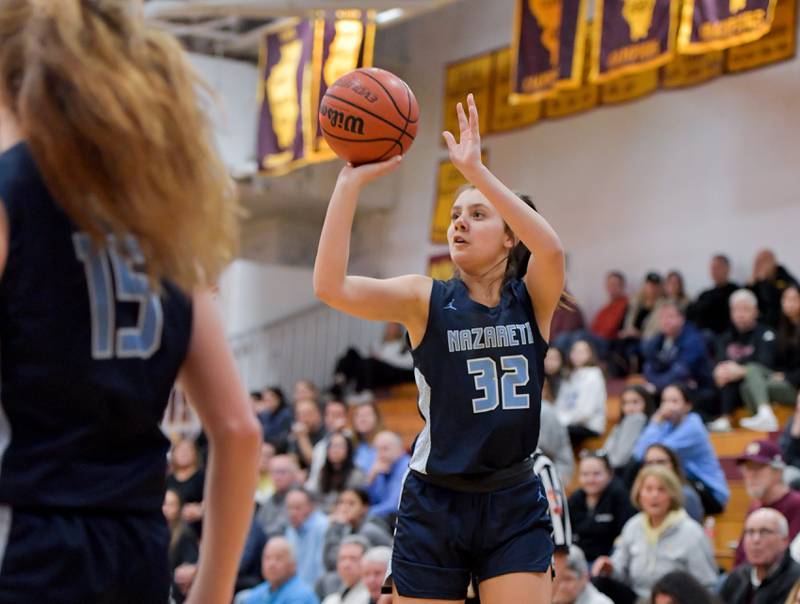 Nazareth's Stella Sakalas (32) sinks a 3-point shot against Montini during the semifinals of the Montini Christmas Tournament on Thursday, Dec. 29, 2022.