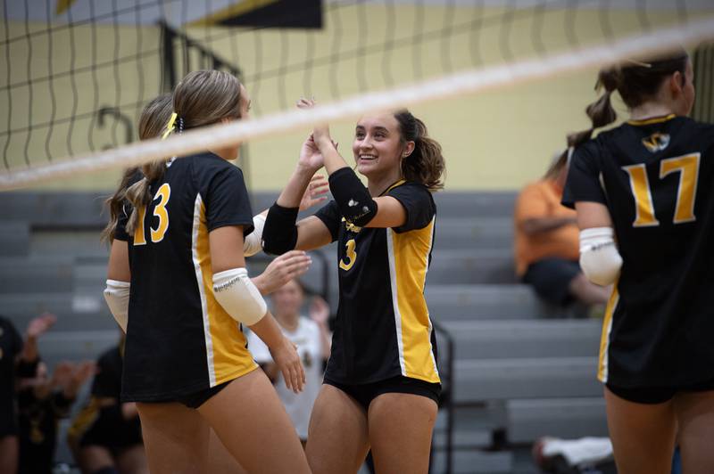 Herscher's Avery Jones, center, reacts with her team on a match win over Clifton Central on Monday, September 29, 2025.