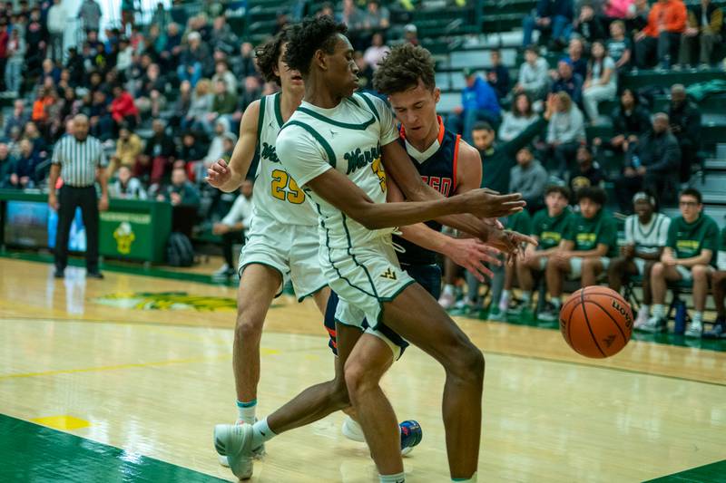 Waubonsie Valley's Tre Blissett (3) and Oswego’s Max Niesman (3) collide during a Waubonsie Valley 4A regional semifinal basketball game at Waubonsie Valley High School in St.Charles on Wednesday, Feb 22, 2023.