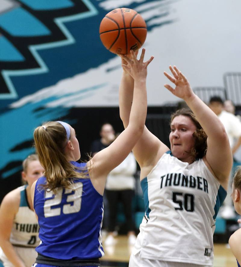 Woodstock North’s Ashley Janeczko passes the ball as she is guarded by Woodstock's Addison Walker during a Kishwaukee River Conference girls basketball game on Friday, Jan. 5. 2024, at Woodstock North High School.