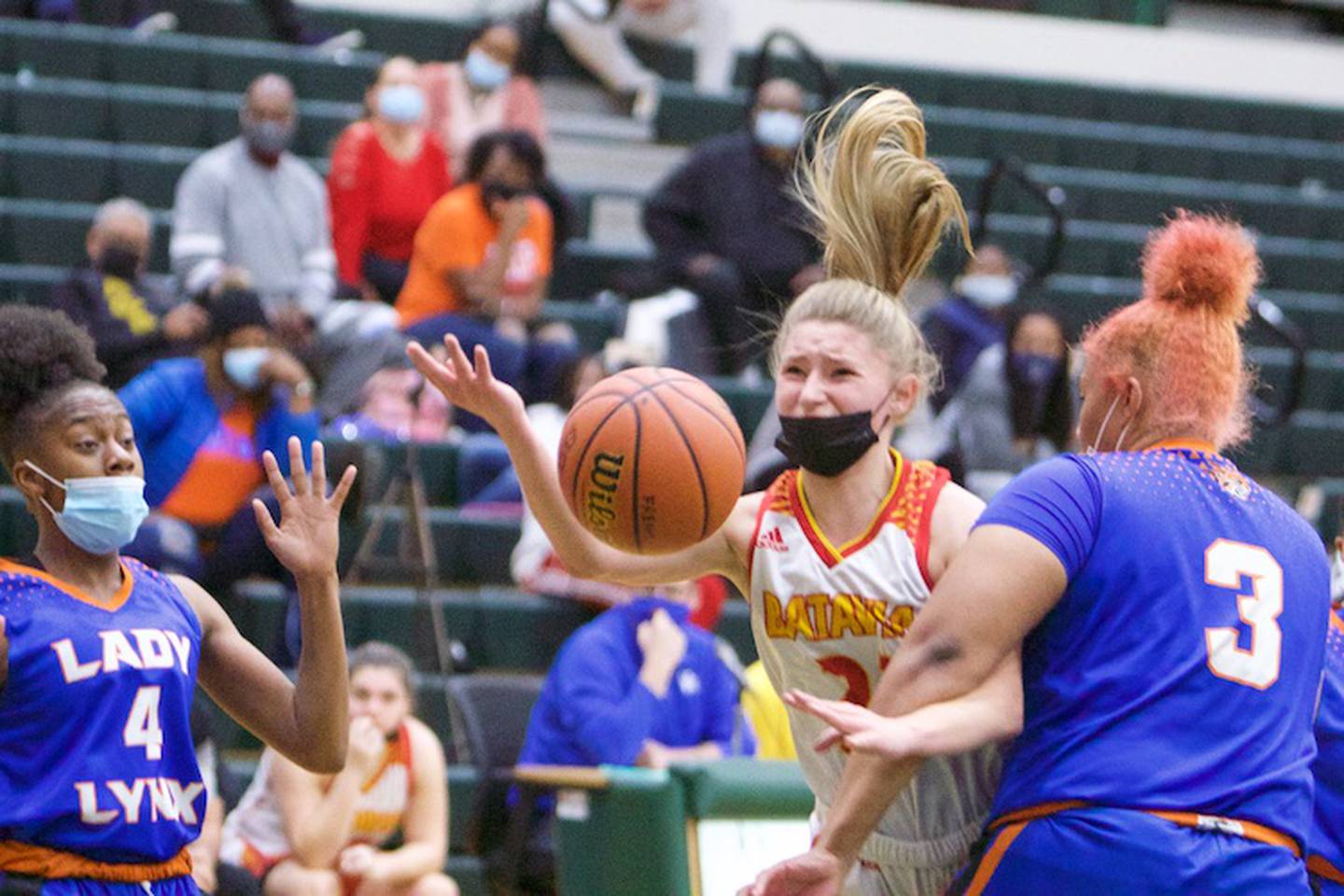 Batavia's Kylee Gehrt is fouled on the shoot by Butler Prep's Chrislin Brewer