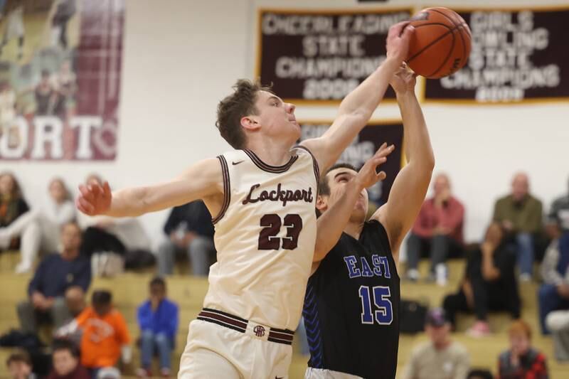 Lockport’s Collin Miller blocks a shot by Lincoln-Way East’s Luke Vetter on Friday, Dec. 1, 2023 in Lockport.