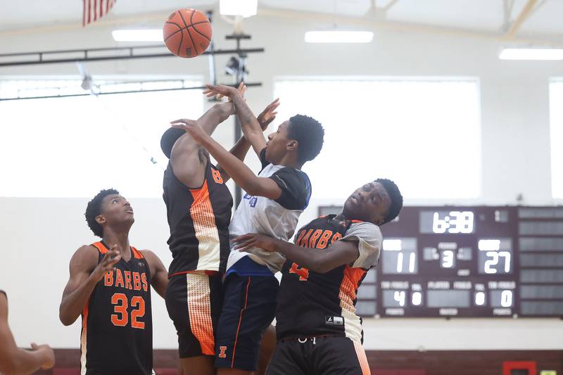 Joliet Central’s BJ Fox blocks a shot against DeKalb at the 37th Morris Boys Shootout on Tuesday, June 25, 2024.