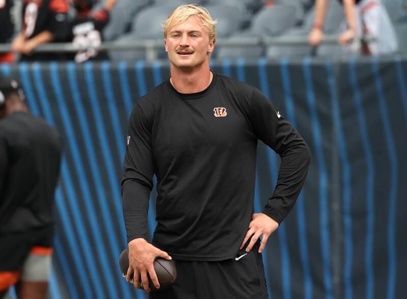 Former Northern Illinois University and current Cincinnati Bengals quarterback Rocky Lombardi looks out over Soldier Field as he loosens up before making his NFL debut Saturday, Aug. 17, 2024, in Chicago. Lombardi checked in during the second half of a 27-3 loss to the Chicago Bears. Lombardi is competing for a roster spot with the Bengals.