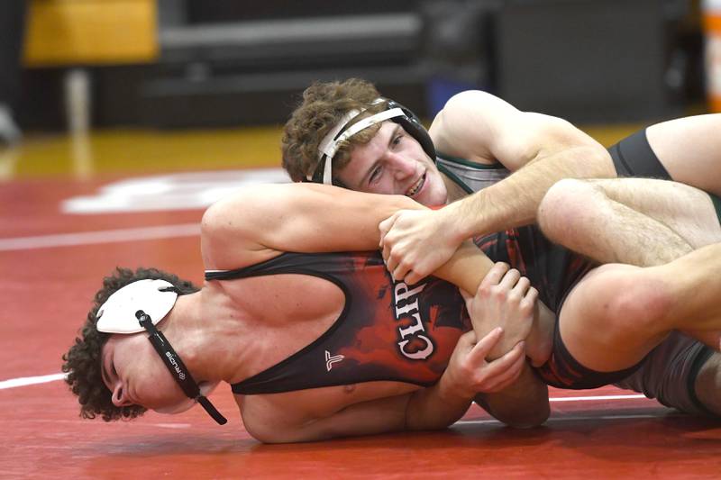 West Carroll's Cole Herrell locks up  Amboy's Samuel Navejas at 150 pounds during a match at Oregon High School on Tuesday, Nov. 25, 2025.