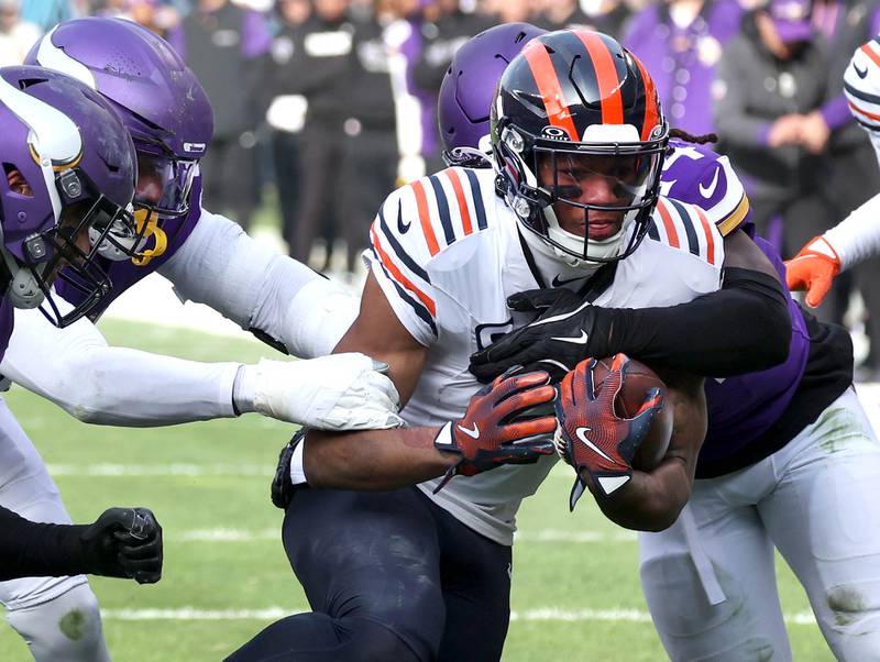 Chicago Bears wide receiver DJ Moore takes the ball down to the Minnesota 2 yard-line as he is tackled by a host of Minnesota Viking defenders during their game Sunday, Nov. 24, 2024, at Soldier Field in Chicago.