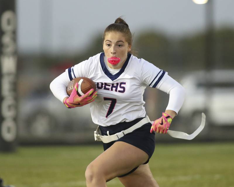 Oswego East's Brianna Lill (7) runs after a catch during Oswego East Regional Final flag football game between St. Charles North at Oswego East Thursday, Oct 9, 2025 in Oswego.