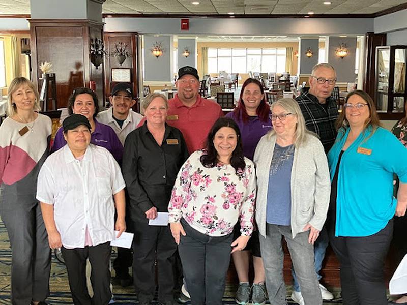 The Fountains at Crystal Lake recently honored its longest-serving employees. Pictured from left are: Honorata Borucki, program director of Assisted Living; Erika Johnson, housekeeper; Reyna Jimenez, cook (front row); Gesvin Mejia, cook (back row); Mary Williams, dining room manager; Mark Curran, maintenance director (back row); Amy Dunn, executive director (front row); Manda Mayfield, housekeeper (back row); residents Connie and John Mertes and Gina Alessi, community life director.
