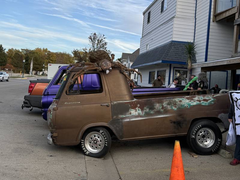 A giant spider takes over an old Ford Econoline outside Jerry's Glass and Lock on Liberty St.