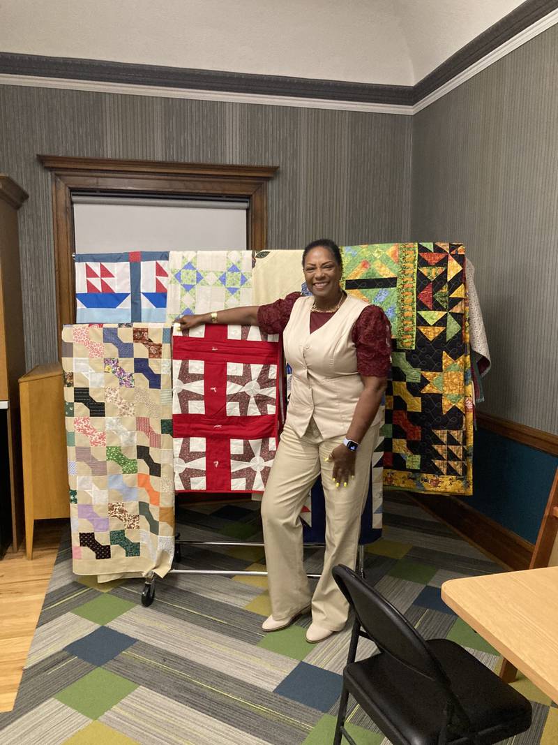 Connie Martin stands next to her replica Underground Railroad quilts Tuesday, June 26, 2024, after her presentation at the Streator Public Library.
