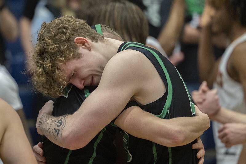 Rock Falls’ Kuitim Heald hugs Nehemiah Menendez at the end of their loss to Christ the King Monday, March 10, 2025, during the Class 2A boys basketball Supersectional in Sterling.