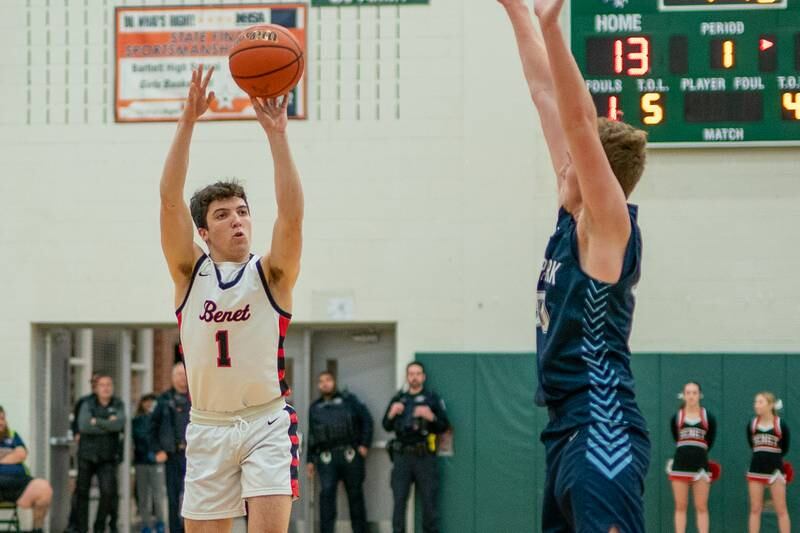 Benet’s Sam Driscoll (1) shoots a three-pointer against Lake Park's Michael Walsh (20) during a Bartlett 4A Sectional semifinal boys basketball game at Bartlett High School on Tuesday, Feb 28, 2023.