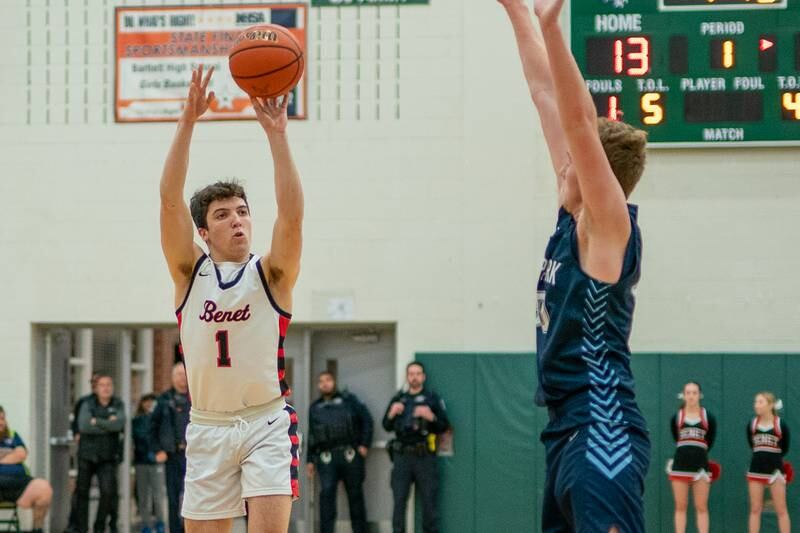 Benet’s Sam Driscoll (1) shoots a three-pointer against Lake Park's Michael Walsh (20) during a Bartlett 4A Sectional semifinal boys basketball game at Bartlett High School on Tuesday, Feb 28, 2023.