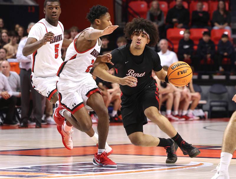 Benet's Jayden Wright works against Marist's Torrence Tate Jr. Saturday, March 14, 2026, during their IHSA Class 4A state championship game in the State Farm Center at the University of Illinois in Champaign.