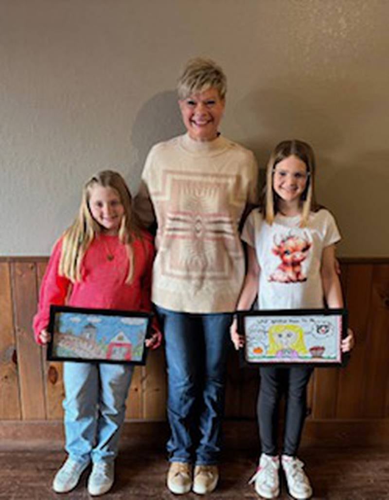 (From left) Brynleigh Bickett, Jodi McMillan, Bureau County Ag Literacy Coordinator; and Avery Ross pose for a photo. Bickett won Best of Show from Mrs. Smoode’s class at Malden Grade School and Ross from Mrs. Quanstrom’s class at Lincoln Elementary, Princeton.