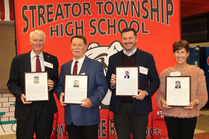 Four Streator High School alums were inducted to the Dr. Worthy Streator Hall of Fame on Saturday, Dec. 2, 2023. Pictured are Justice Eugene Daugherity, Class of 1964; Craig Roberts, Class of 1961; Derek Reed, Class of 2000; and Beth Bute, accepting on behalf of her husband inductee, Judge Daniel Bute, Class of 1969.