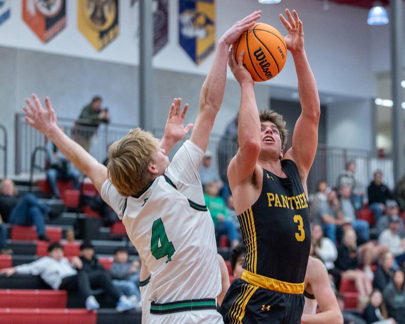 Connor South (4) of Rock Falls blocks shot from Johnathan Stunkel (3) of Putnam County as he goes up for a layup during the Colmone Classic on Monday, December 8, 2025 at Hall High School in Spring Valley.