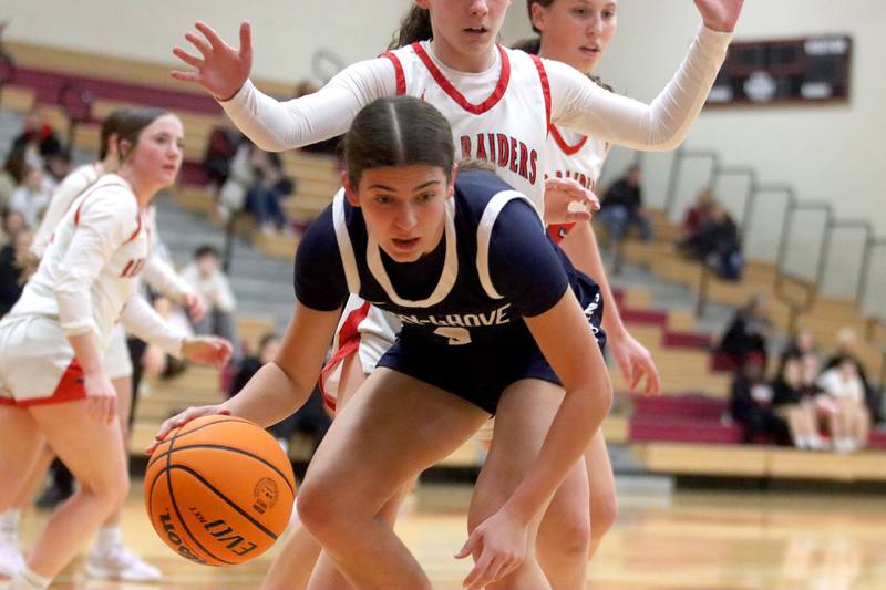 Cary-Grove’s Kennedy Manning moves the ball under the net  in varsity girls basketball on Monday, Feb. 2, 2026, at Huntley High School in Huntley.