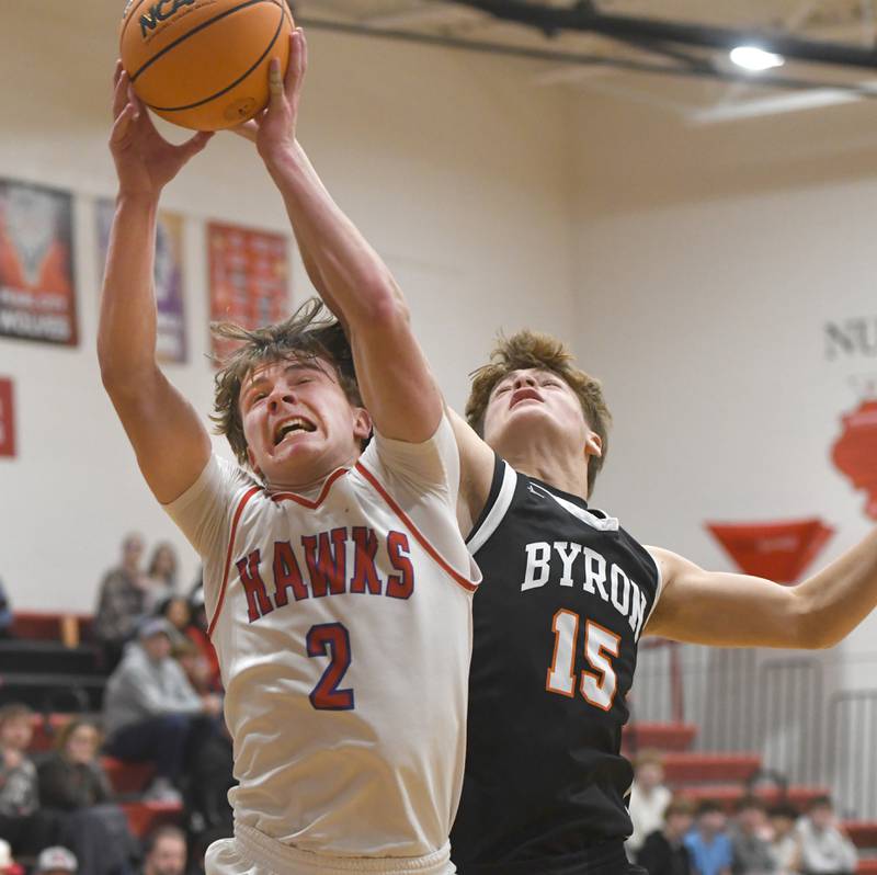 Oregon's Cooper Johnson (2) battles Byron's Ben Hiveley for a rebound during a Monday, Dec. 15, 2025 game at the 64th Forreston Holiday Tournament at Forreston High School.