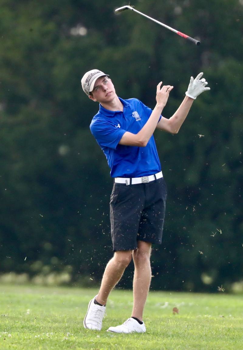 Newman's Logan Palmer tosses his club up after taking a swing Monday at Wyaton Hills Golf Course in Princeton.
