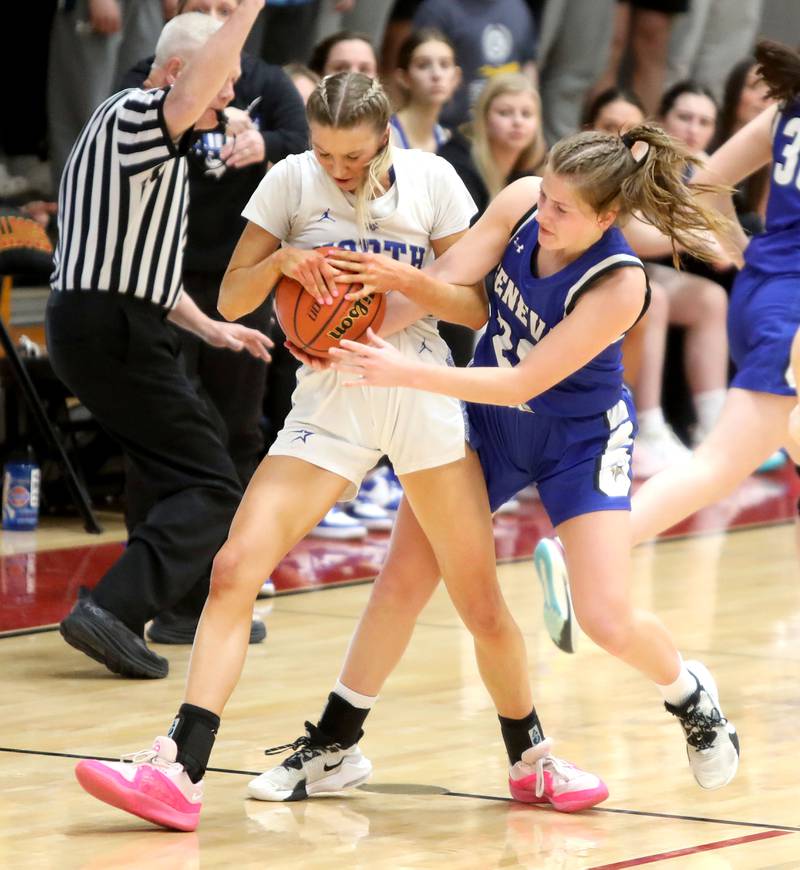 St. Charles North Reagan Sipla (left) and Geneva’s Caroline Madden battle for the jump ball during a Class 4A Batavia Sectional semifinal game on Tuesday, Feb. 20, 2024.