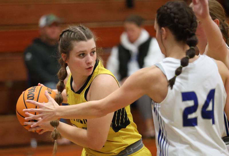 Putnam County's Cadence Breckenridge, looks to pass around Princeton's Keighley Davis, during the Tiger Girls Basketball Holiday Tournament on Tuesday, Nov. 18, 2025 at Princeton High School.