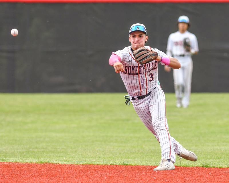 Romeoville's Karlos Otero (3) throws out the runner at first on Thursday May 29, 2025, during the regional game while taking on Yorkville held at Yorkville High School.