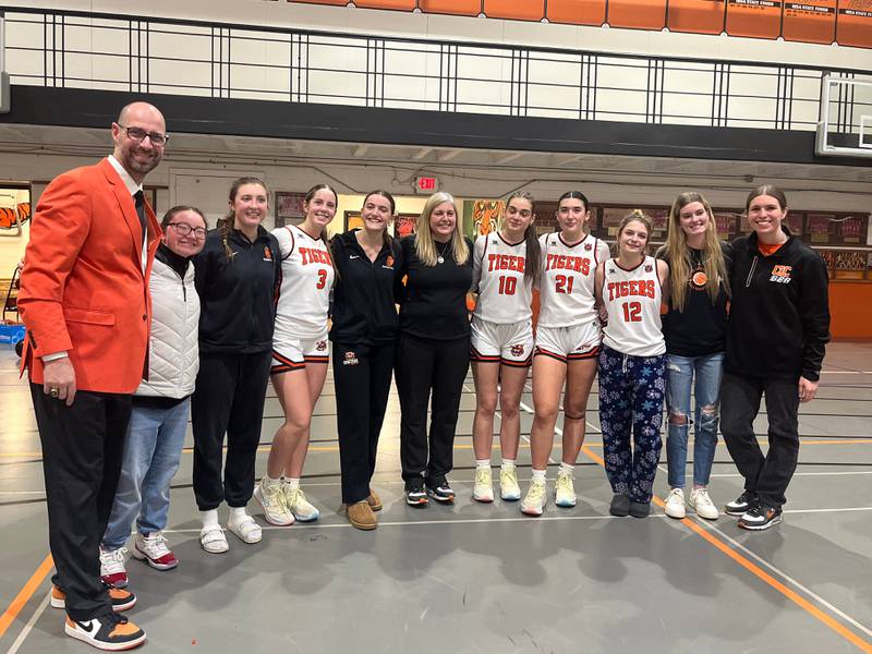 Crystal Lake Central's Katie Hamill (fifth from left) and the rest of the Tigers' seniors pose after Thursday's 47-30 win against Dundee-Crown. Hamill scored 27 points and broke the program's all-time scoring record that stood for 42 years.
