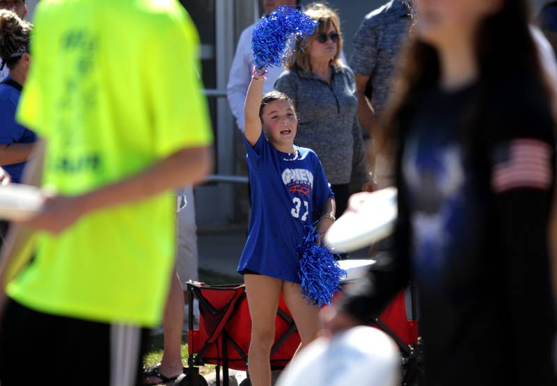Ava Wilkison, 9, cheers as the Geneva High School Homecoming Parade makes its way down State Street on Friday, Sept. 15, 2023.