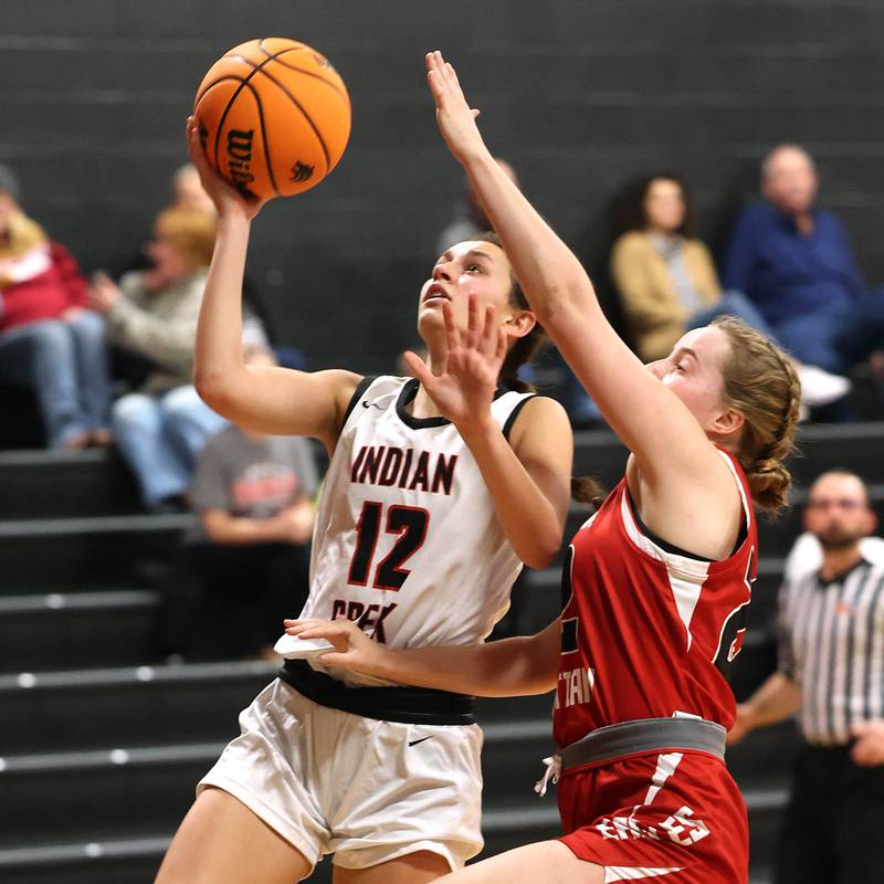 Indian Creek's Isabella Turner gets a shot up over Aurora Christian’s Grace Kendall during their game Monday, Nov. 25, 2024, at Indian Creek High School in Shabbona.